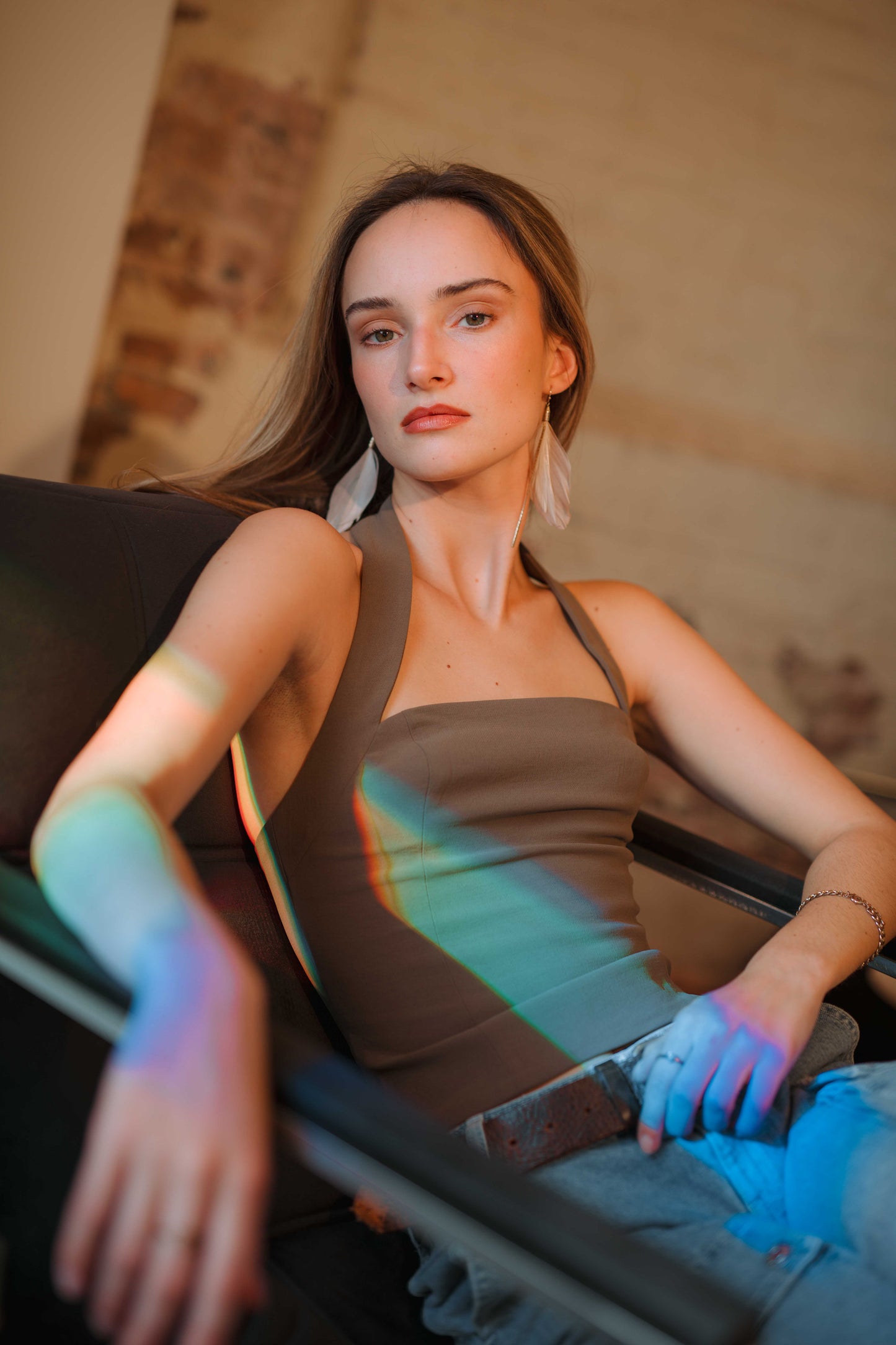 Woman sitting in a chair with colorful light effects